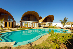The pool stretches right across the whole hotel. Swim from your room right to the bar.